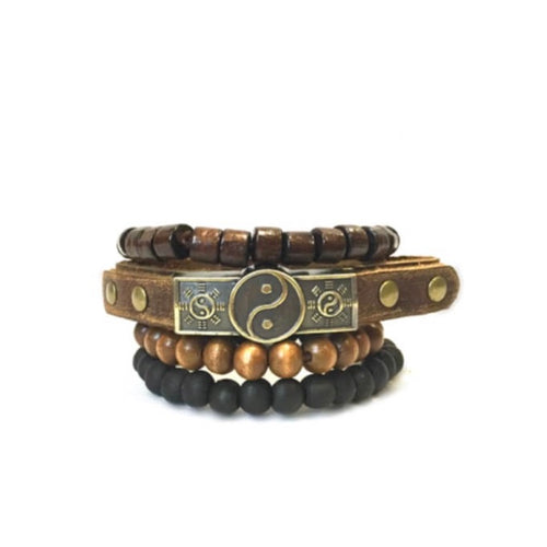 4 row bracelet with dark brown chunky beads on top row, brown leather with antique metal yin and yang symbol 2nd row, light brown round beads 3rd row, black round beads last row