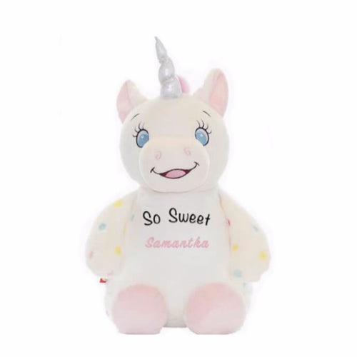 Cream colored unicorn with blue eyes,  pink hair tuft, light pink feet bottoms, cute smile, pastel rainbow polka dotted arms, silver shimmer horn,  So Sweet in black text, and a child's name in light pink text on belly