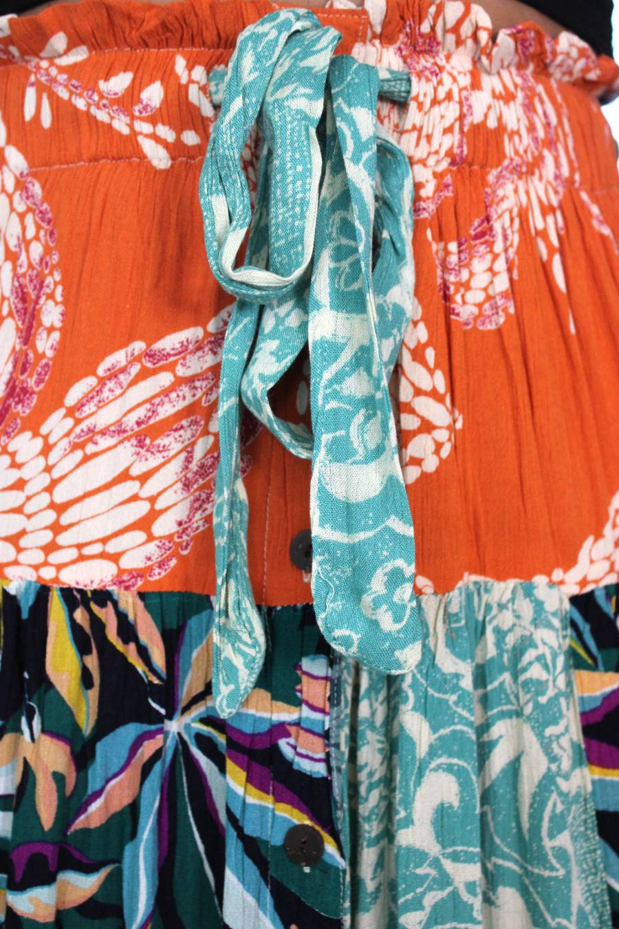 Up close tie photo of boho fabric with floral patterns wrap skirt