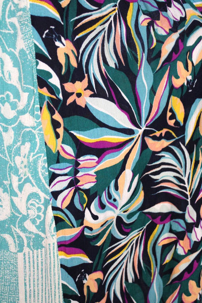 Colorful tropical leaf pattern on a textured fabric