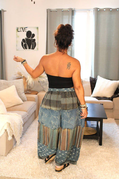 Model posing to show back of pants.