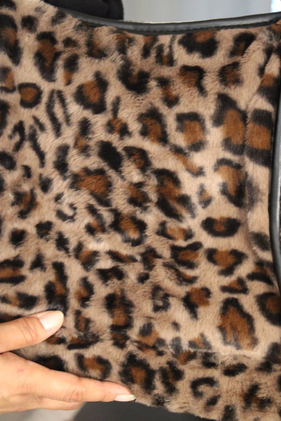 Close-up of a leopard print fuzzy soft fabric.