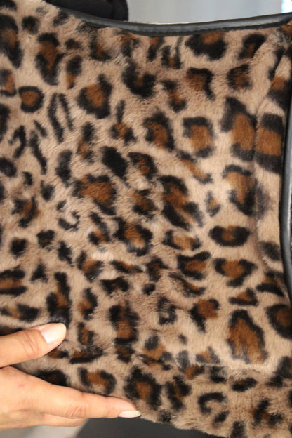 Close-up of a leopard print fuzzy soft fabric.