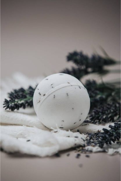 White bath bomb with black lavender flowers.