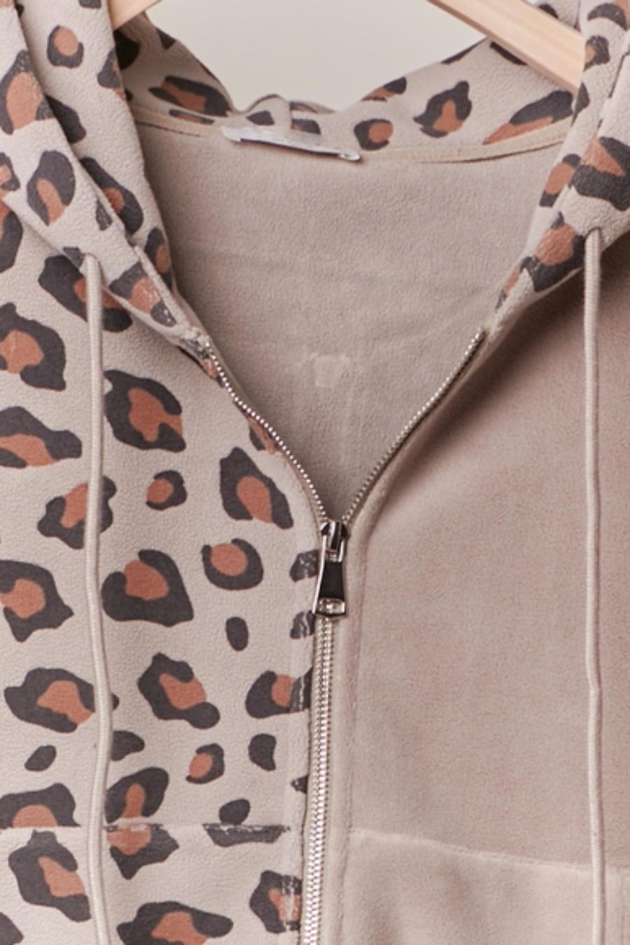 Leopard print hoodie with a zipper on a neutral background
