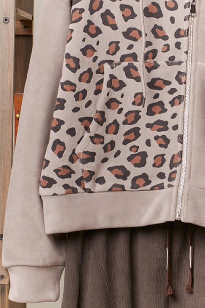 Close-up of beige leopard print hoodie print.