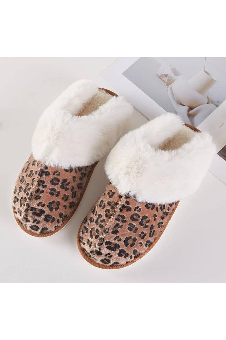 Pair of leopard print slippers with white fur lining.