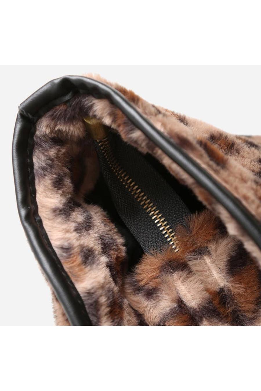 Leopard print tote bag with a gold zipper & black handles.