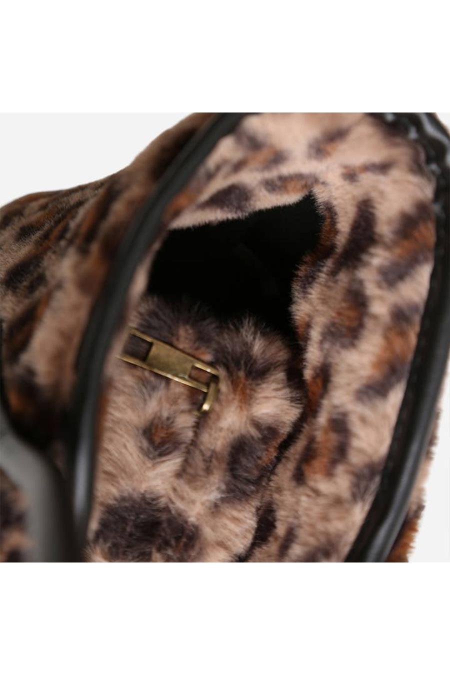 Leopard print bag with a gold zipper.