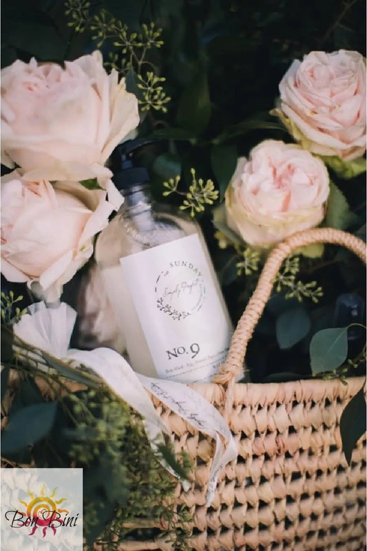 A clear pump bottle of No. 9 body wash with a white label that includes the product name and a brief description.