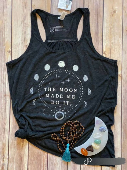 Incredibly dark grey (almost black) racerback tank with "The Moon Made Me Do It" text in white. Also features white moon phase design on front.