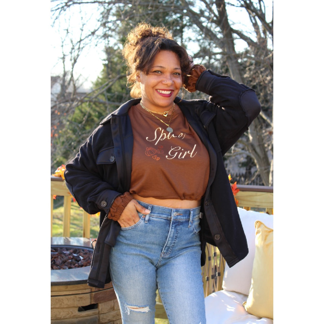 Front view of black fleece shacket layered with spice girl sweatshirt and light wash distressed jeans