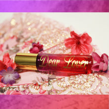Load image into Gallery viewer, Violet to red ombre glass perfume rollerball oil with gold lid &amp; lettering.
