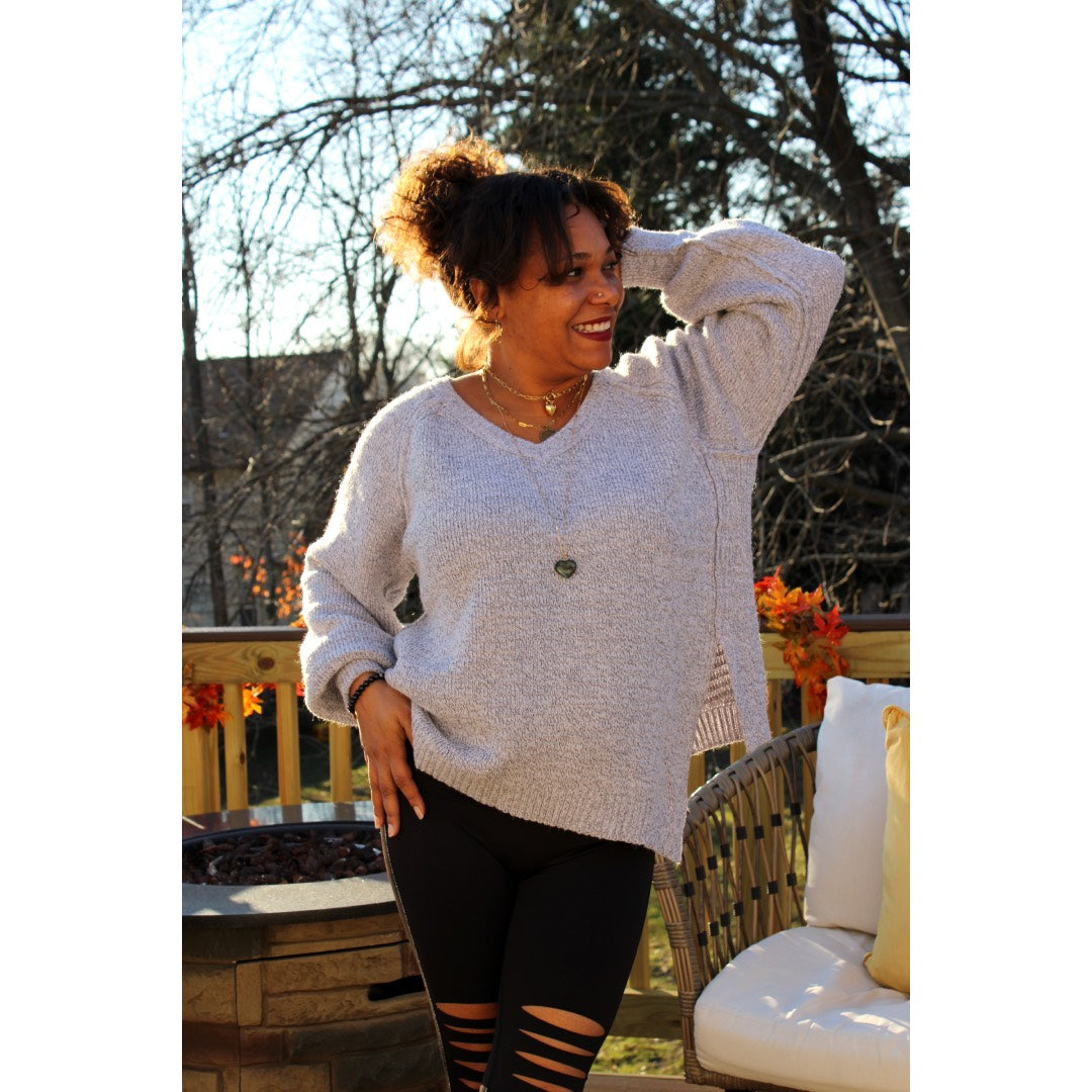 Front view of Lavender Gray sweater tunic with left side seam slit and black knee cut out leggings