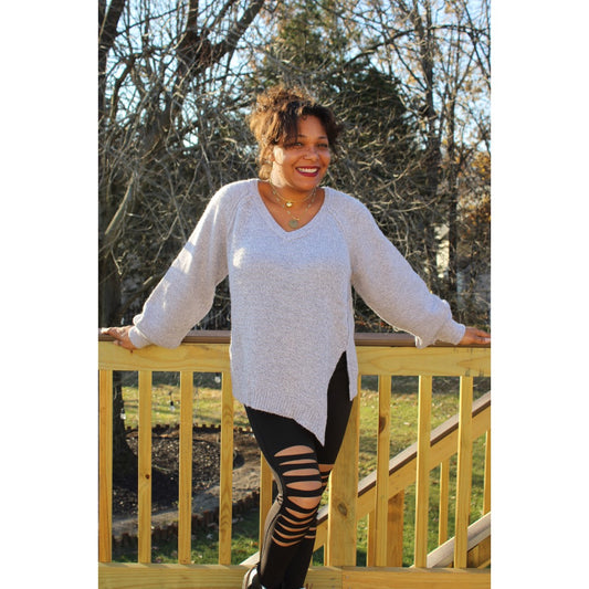 Front view of Lavender Gray sweater tunic with left side seam slit and black knee cut out leggings