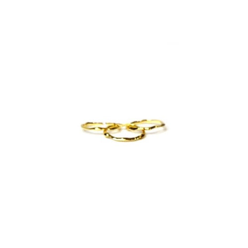 Three thin gold irregularly shaped beveled circle rings